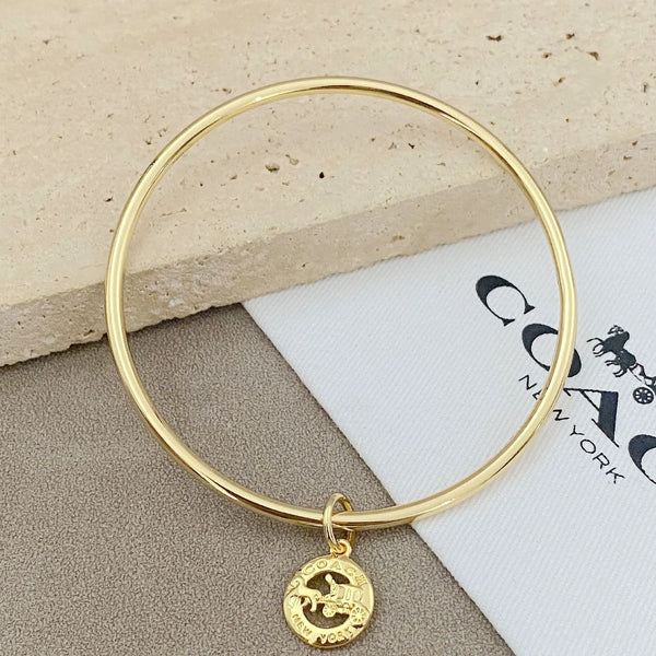 Trainer Luxe Signature Golden Halo Bangles (Set of 3)