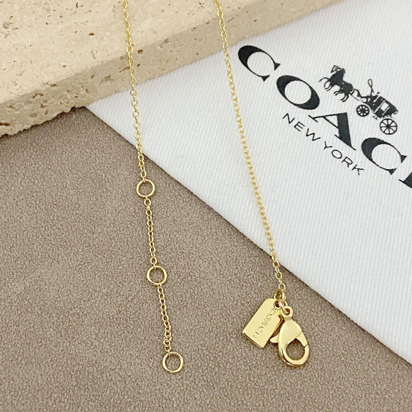 Trainer Luxe Radiant Heart Monogram Pendant