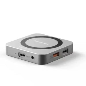 Wireless charging pad with USB ports on a white background