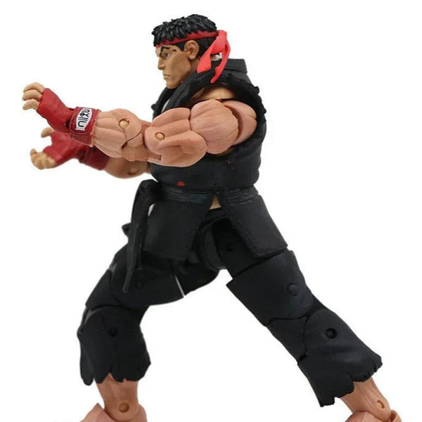 Action figure in black outfit with red accents on a white background