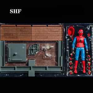 Spider-Man action figure in packaging with a miniature house model